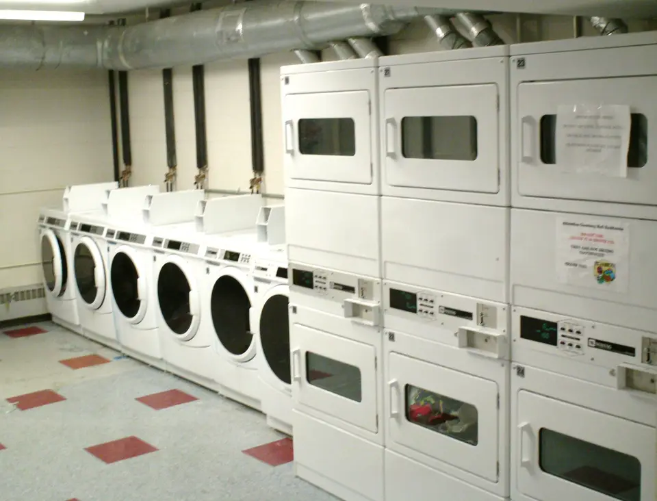 Home laundry room with a front-load washer and dryer side by side
